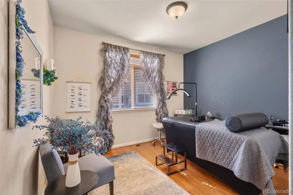 a bedroom with furniture and a window