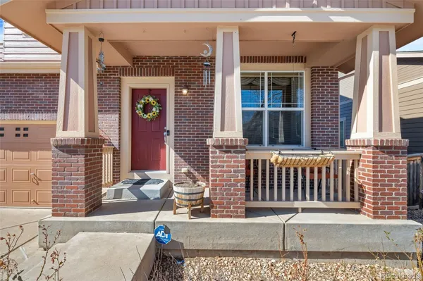 a view of a brick house with large windows