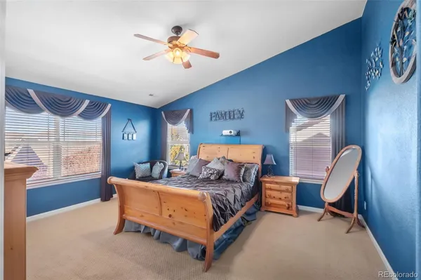 a bedroom with a bed chair and window