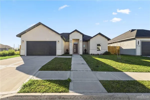 a front view of a house with yard