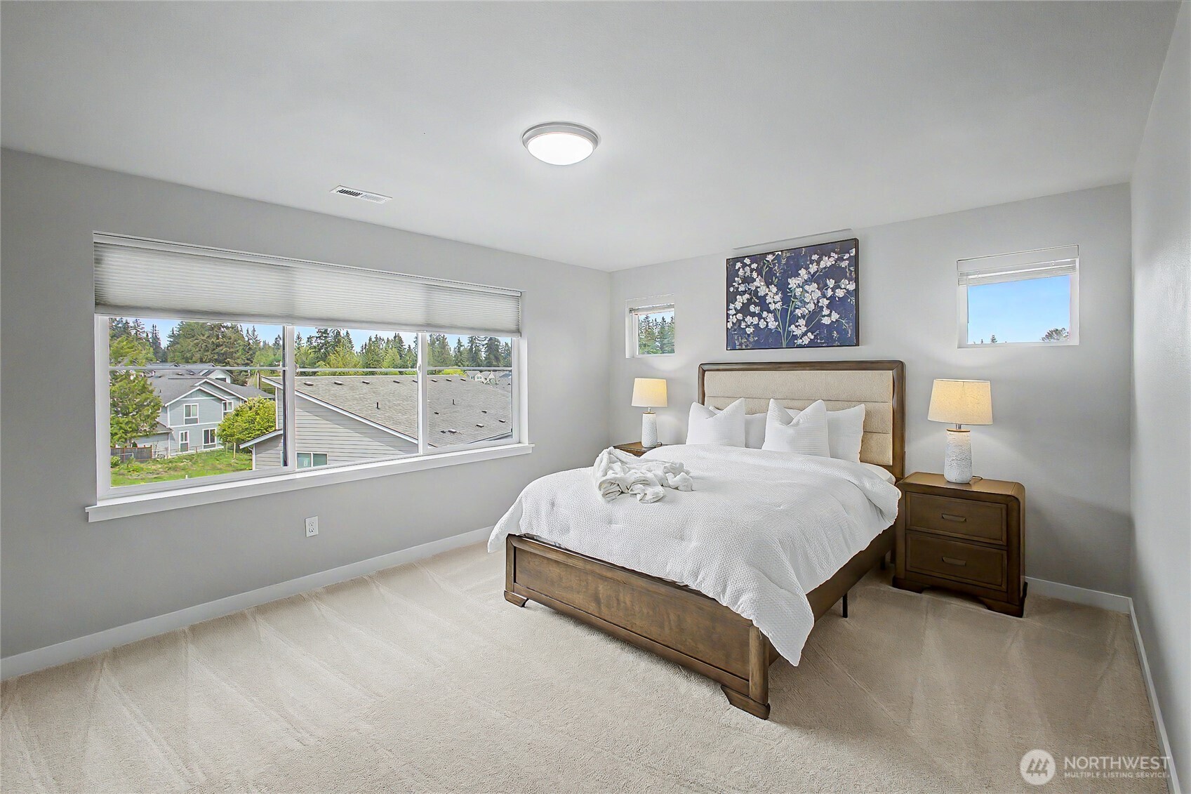 130 198th Street Southeast, Unit 5 Bothell, WA 98012 - Photo 27 of 40 a spacious bedroom with a bed and a large window