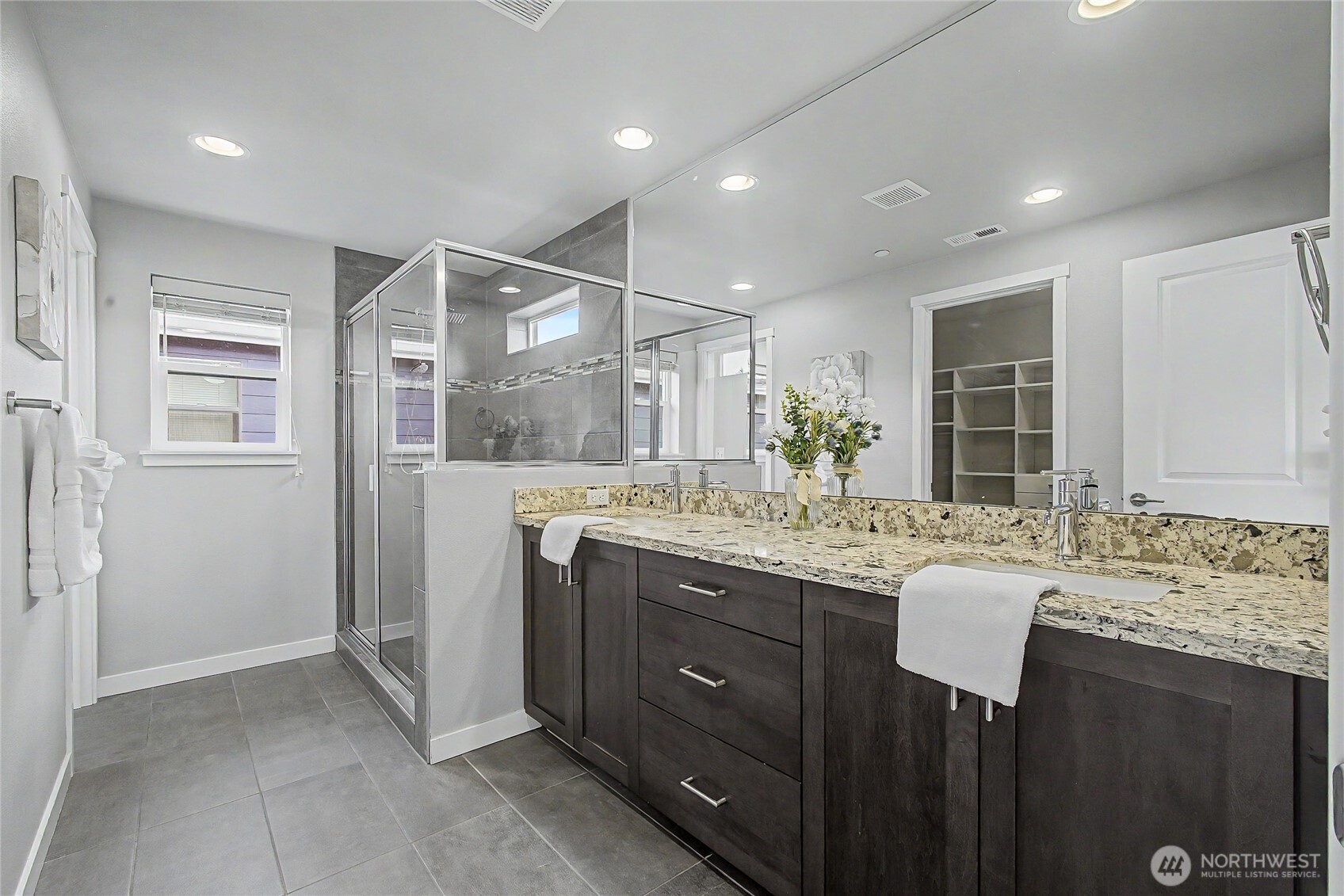 130 198th Street Southeast, Unit 5 Bothell, WA 98012 - Photo 29 of 40 a bathroom with a granite countertop sink and a mirror