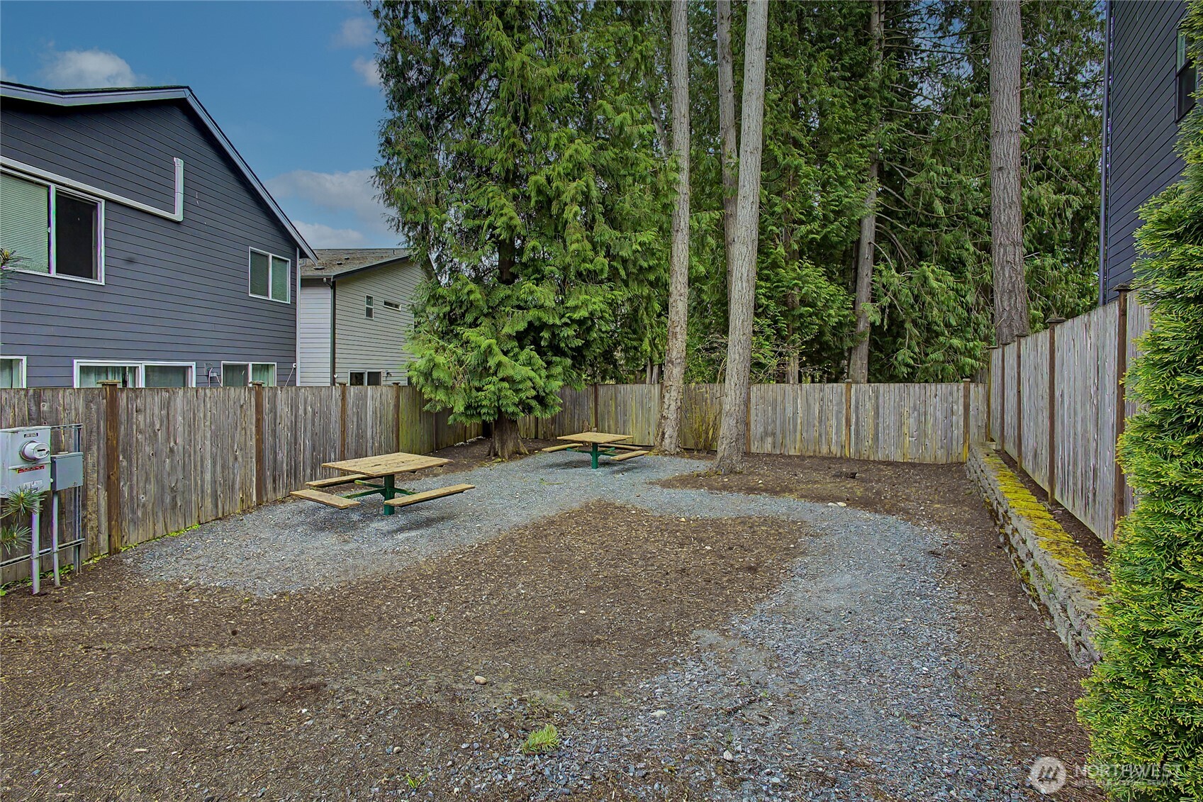 130 198th Street Southeast, Unit 5 Bothell, WA 98012 - Photo 38 of 40 a view of backyard with trees and wooden fence