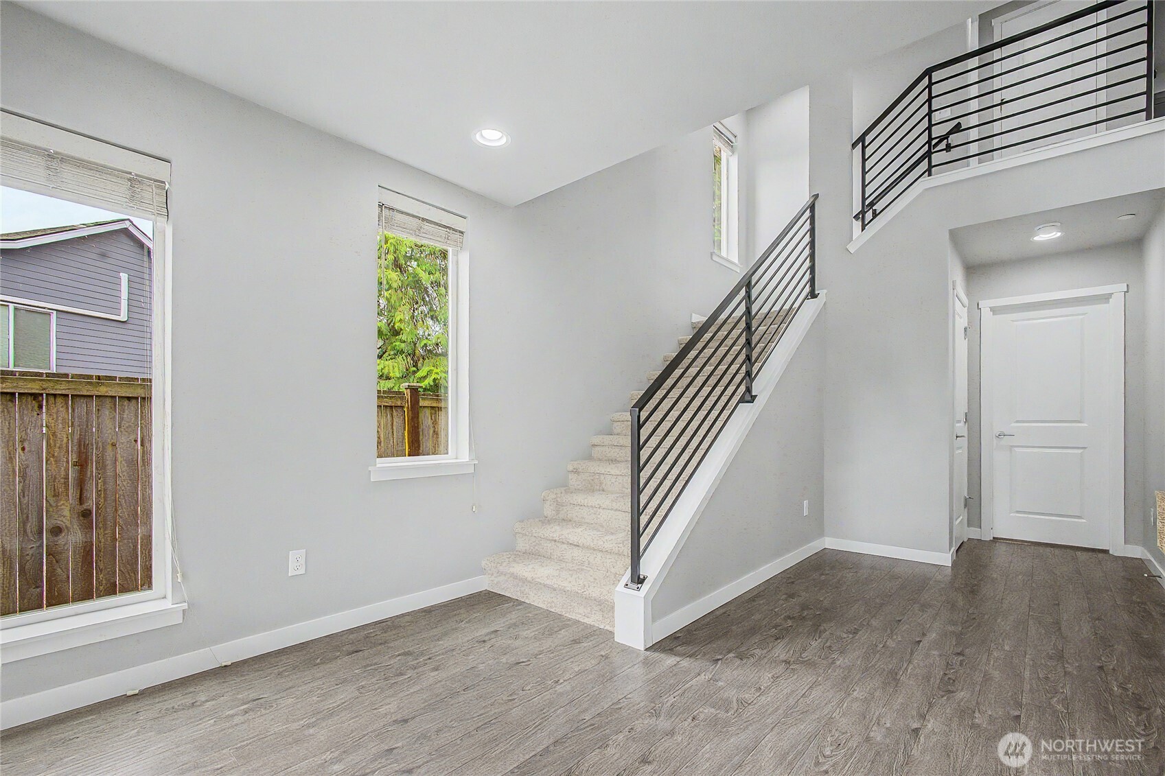 130 198th Street Southeast, Unit 5 Bothell, WA 98012 - Photo 7 of 40 a view of entryway with wooden floor and stairs