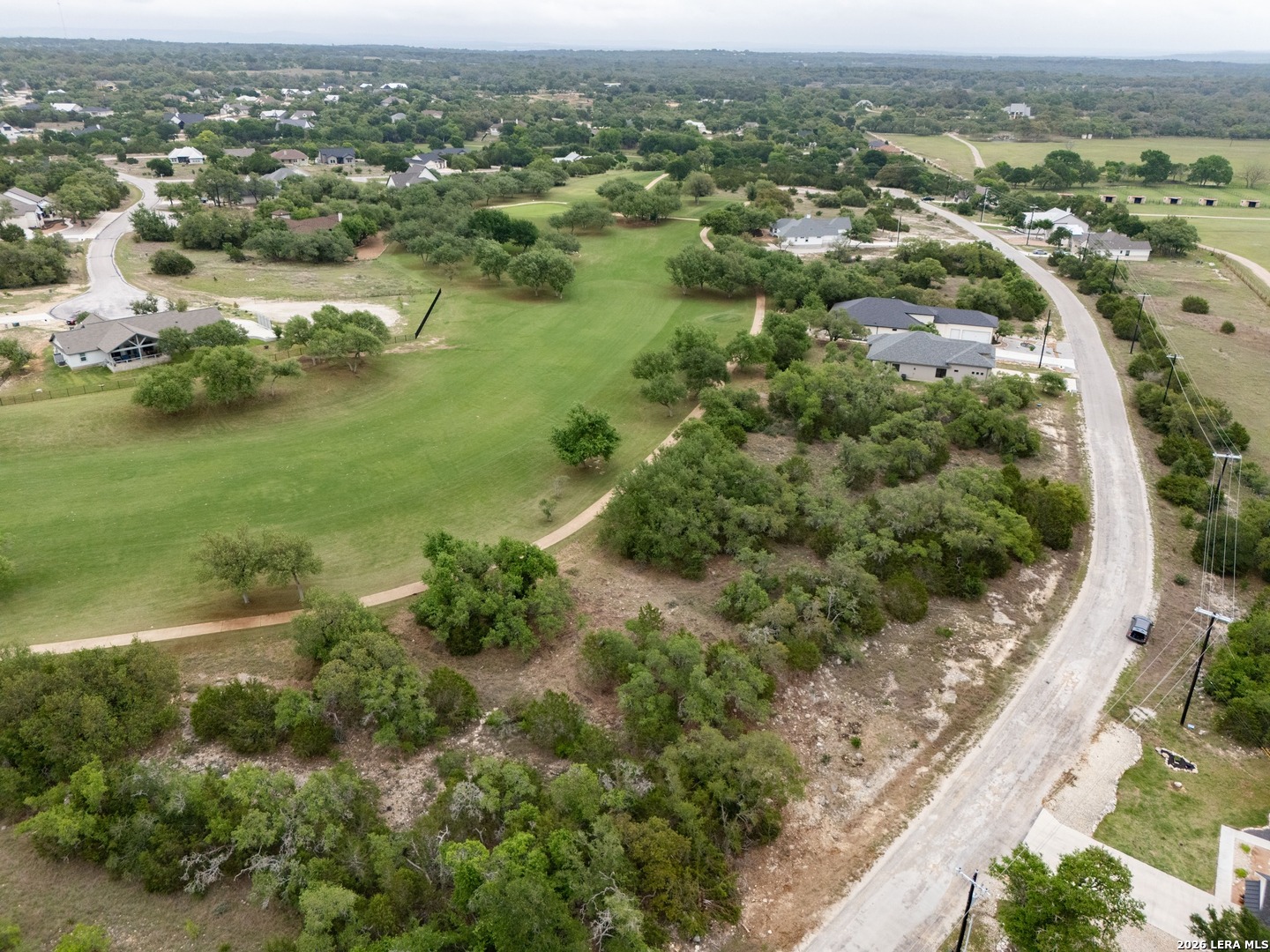 401 George Dolson Blanco, TX 78606 - Photo 11 of 19 an aerial view of residential houses with outdoor space and trees