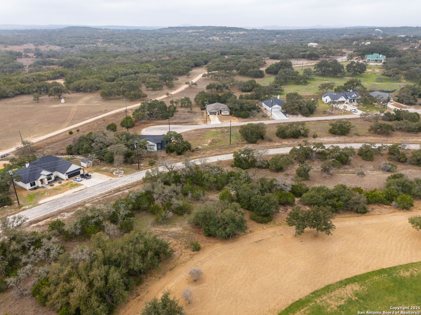 401 George Dolson Blanco, TX 78606 - Photo 7 of 19 a view of a lake with mountains in the background