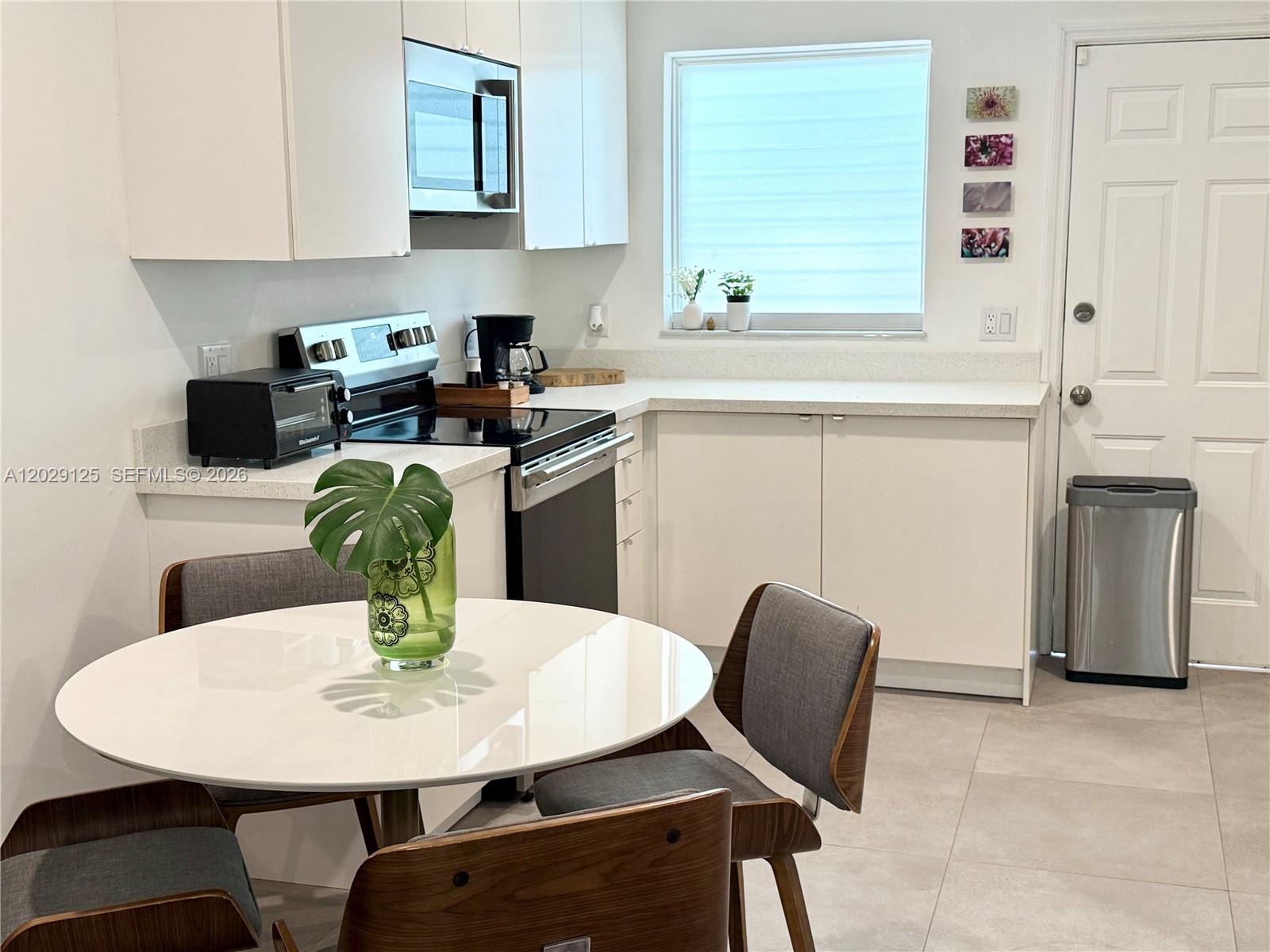 547 Northeast 64th Street, Unit 2 Miami, FL 33138 - Photo 8 of 14 Dining Room & Kitchen