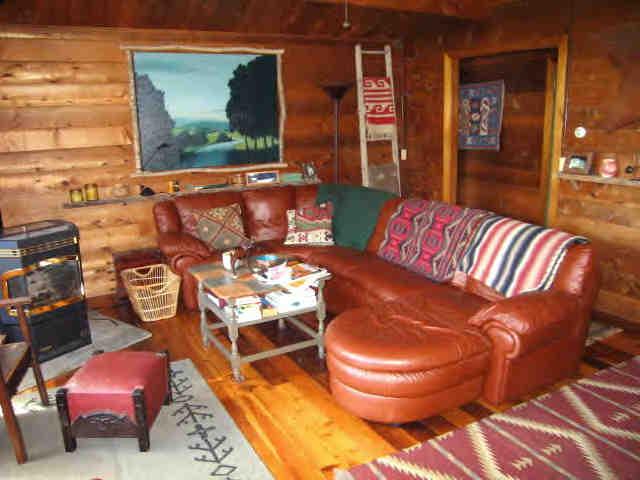 85 Beaver Hill Road Otis, MA 01253 - Photo 2 of 4 a living room with furniture and a floor to ceiling window