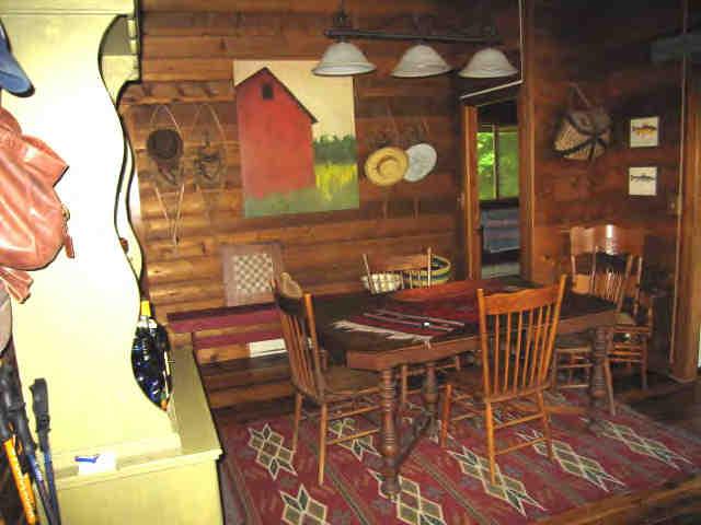 85 Beaver Hill Road Otis, MA 01253 - Photo 3 of 4 a view of a dining room with furniture and chandelier