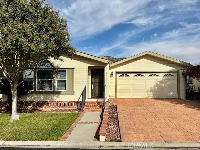 27600 Atlantic Avenue, Unit 427 Highland, CA 92346 - Photo 1 of 20 a view of a house with a porch
