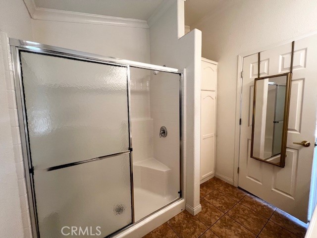 27600 Atlantic Avenue, Unit 427 Highland, CA 92346 - Photo 17 of 20 a bathroom with a glass shower door
