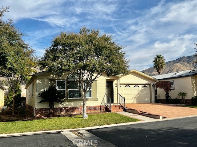 27600 Atlantic Avenue, Unit 427 Highland, CA 92346 - Photo 3 of 20 a view of a house with a yard
