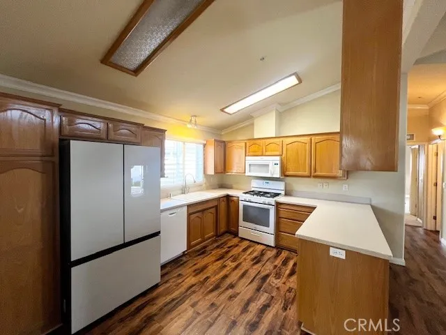 a kitchen with a refrigerator and a stove