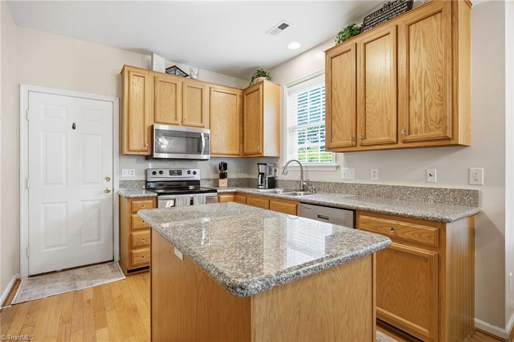 3659 Canopy Oak Court High Point, NC 27265 - Photo 22 of 42 Kitchen with separate island, granite countertops, double bowl sink and lots of cabinet storages.