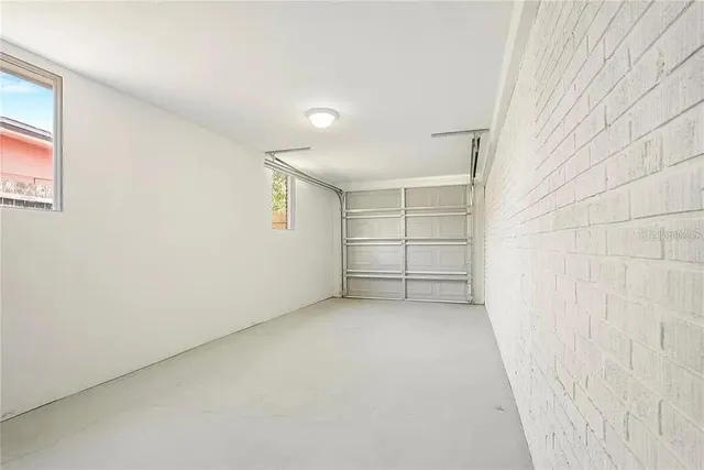 an empty room with a empty space and windows