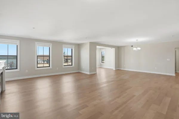 a view of a livingroom with wooden floor