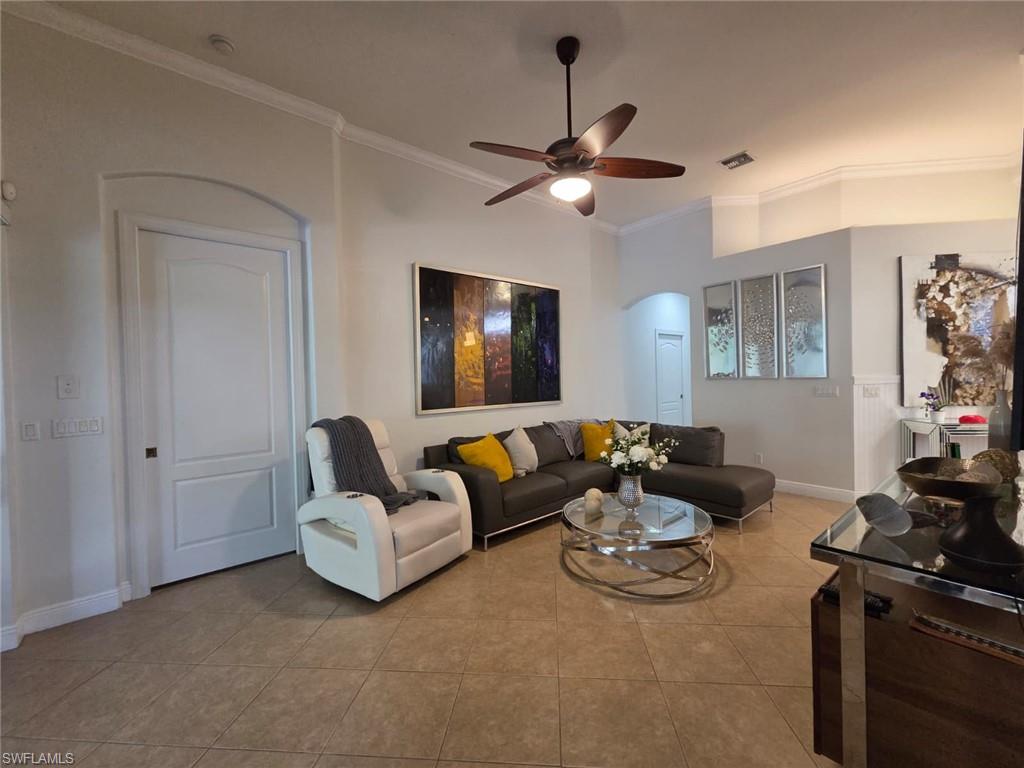 15437 Cortona Way Naples, FL 34120 - Photo 15 of 29 a living room with furniture and a flat screen tv