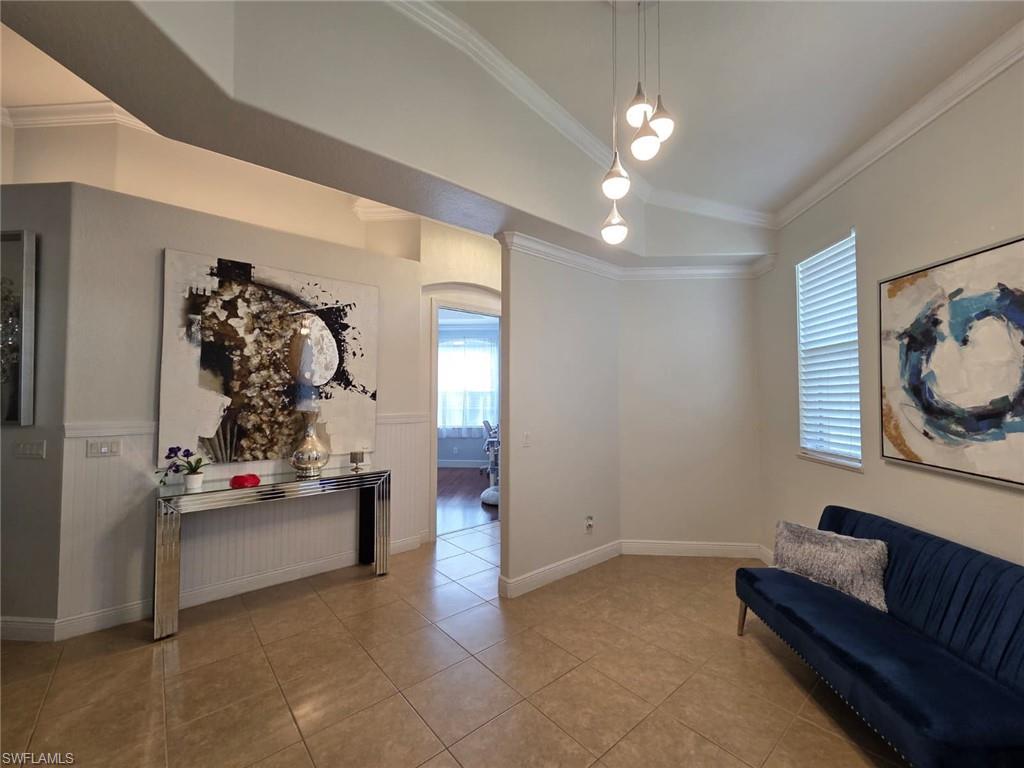 15437 Cortona Way Naples, FL 34120 - Photo 16 of 29 a living room with furniture and decor