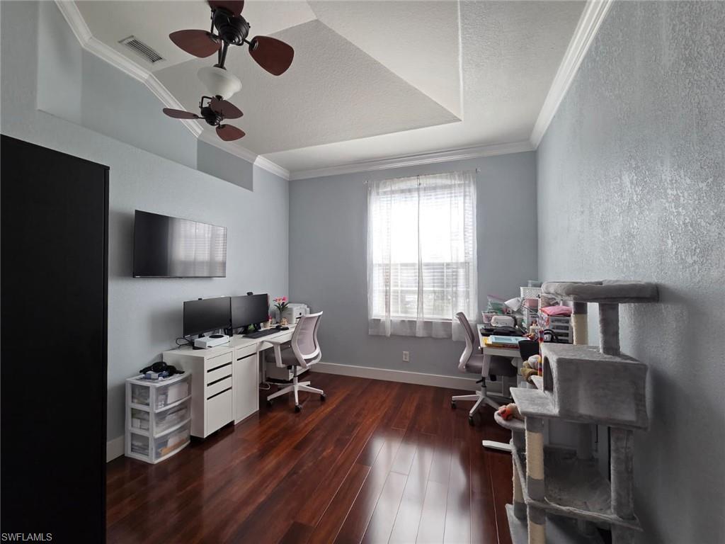 15437 Cortona Way Naples, FL 34120 - Photo 18 of 29 a view of a workspace with furniture and a window