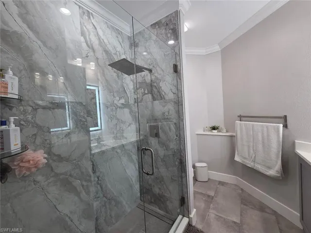 a bathroom with a shower and a toilet