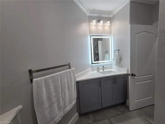 a bathroom with a double vanity sink and mirror