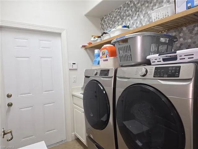 a utility room with dryer and washer