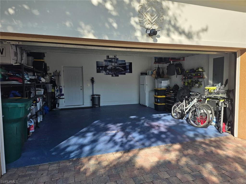 15437 Cortona Way Naples, FL 34120 - Photo 29 of 29 a view of a room with gym equipment