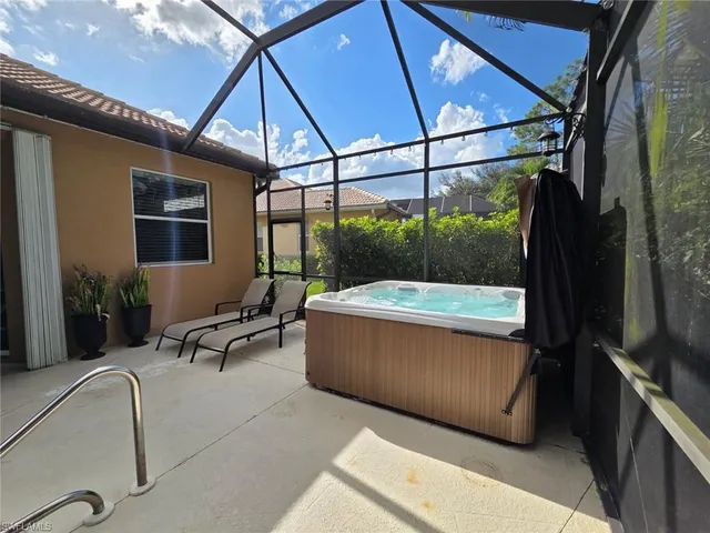 a view of a living room and balcony