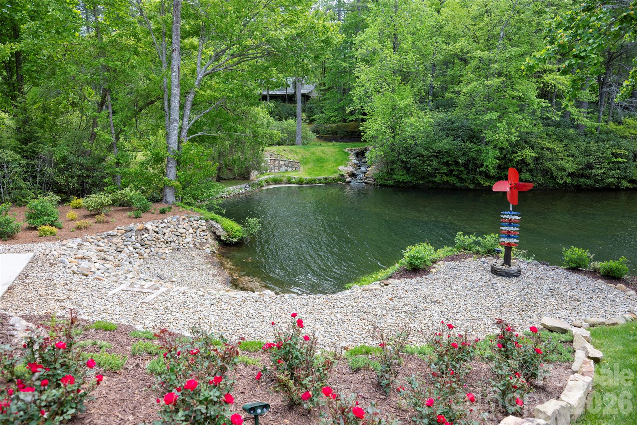 2235 Cold Mountain Road Lake Toxaway, NC 28747 - Photo 39 of 47 a view of a garden with a lake