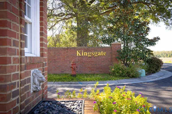 a street sign on a brick wall