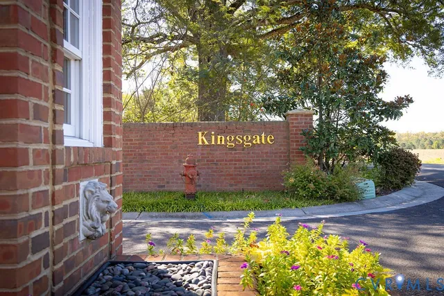 a street sign on a brick wall