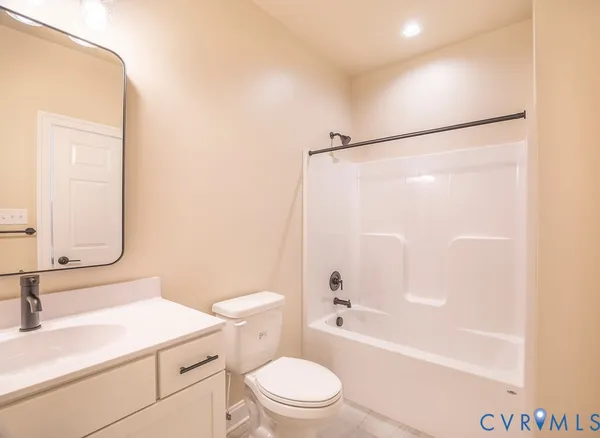 a bathroom with a sink a toilet and a bathtub