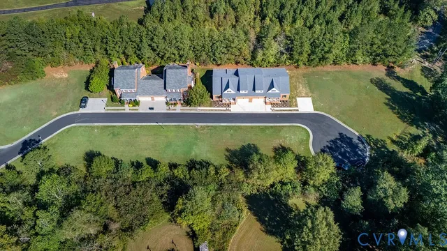 a view of a swimming pool with a yard