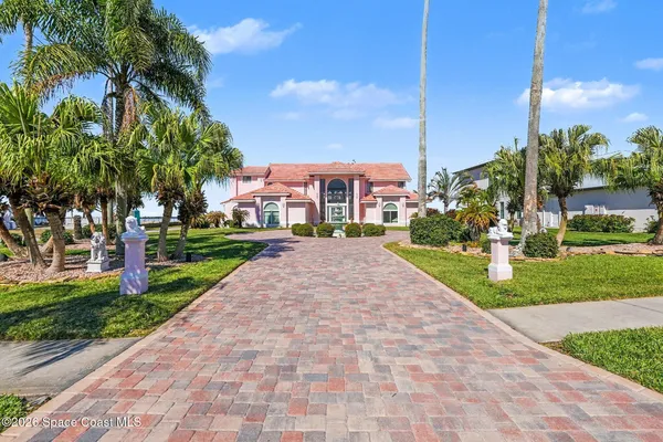 a view of a street with a building and a street sign