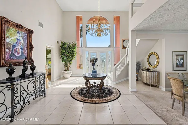a view of a dining room with furniture and window