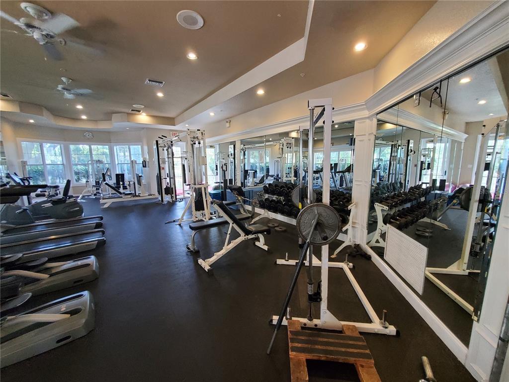 5174 Northridge Road, Unit 209 Sarasota, FL 34238 - Photo 17 of 25 a view of a room with gym equipment and large windows