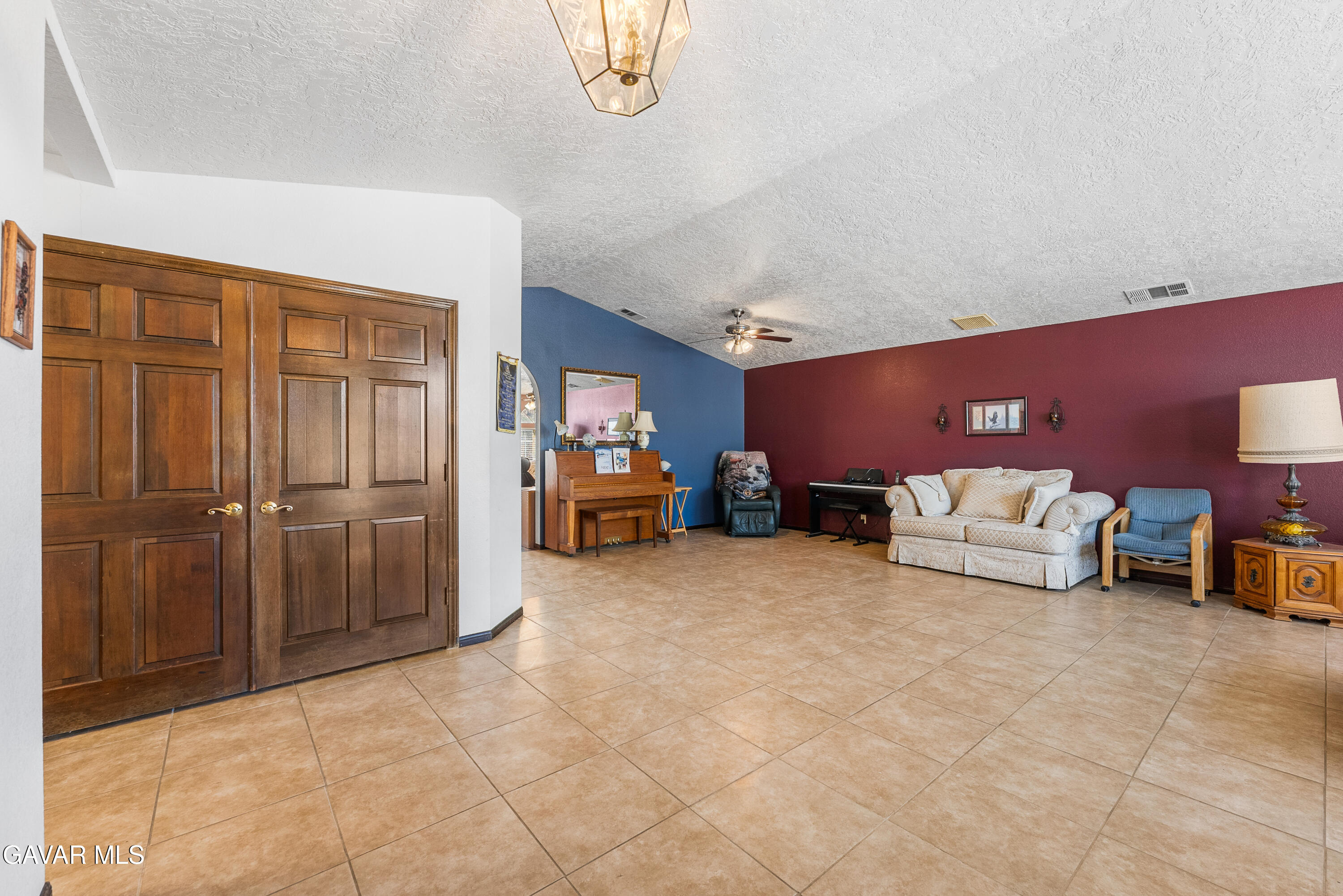 40508 154th Street East Lancaster, CA 93535 - Photo 11 of 20 a bed room with furniture and a chandelier