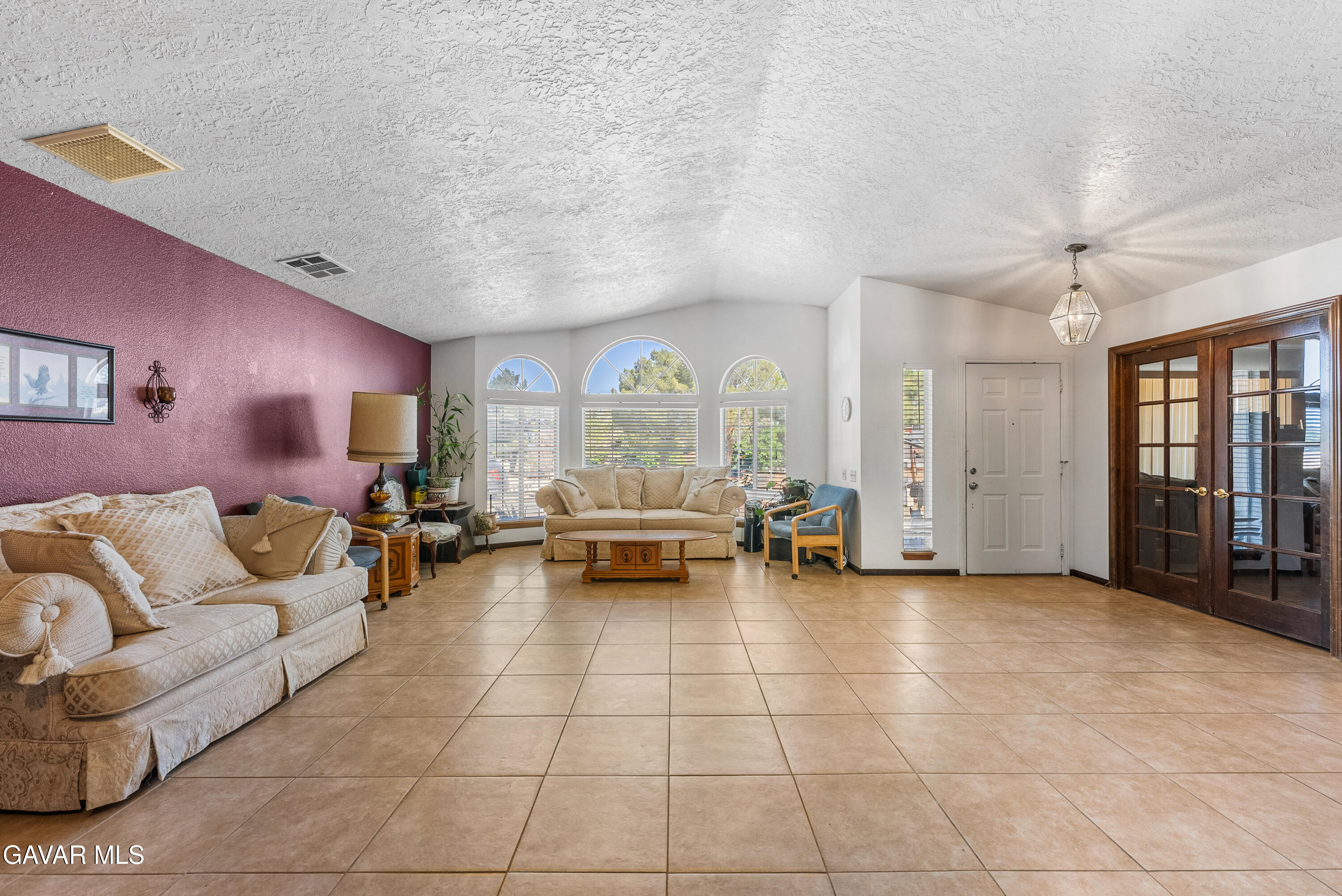 40508 154th Street East Lancaster, CA 93535 - Photo 6 of 20 a living room with furniture and a large window