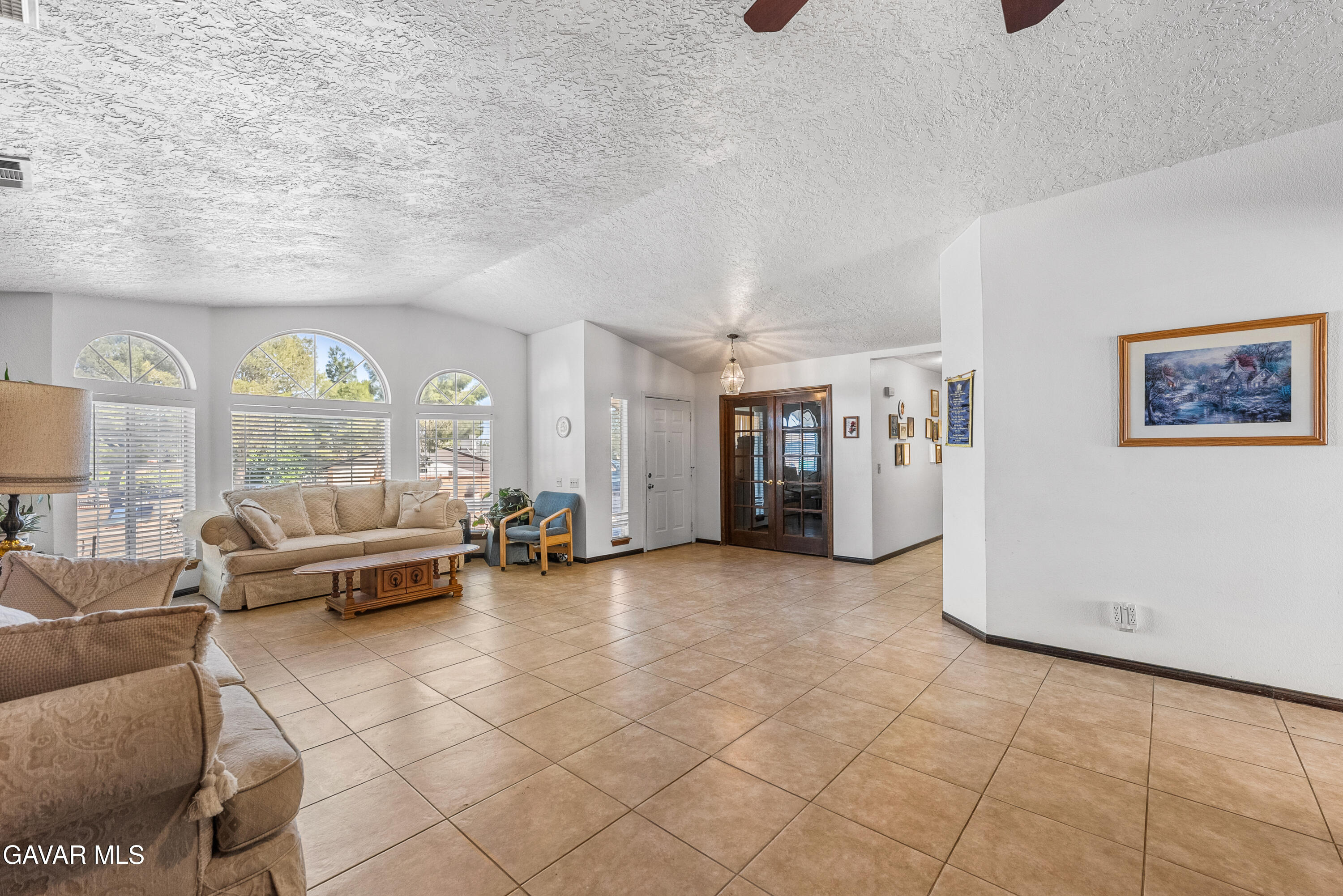 40508 154th Street East Lancaster, CA 93535 - Photo 7 of 20 a living room with furniture and a large window