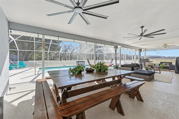 a view of a backyard with seating area