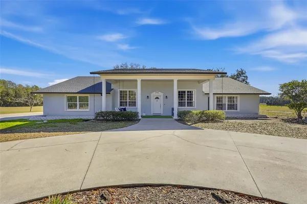 a view of a porch with a backyard