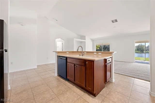 a kitchen with a stove top oven and sink
