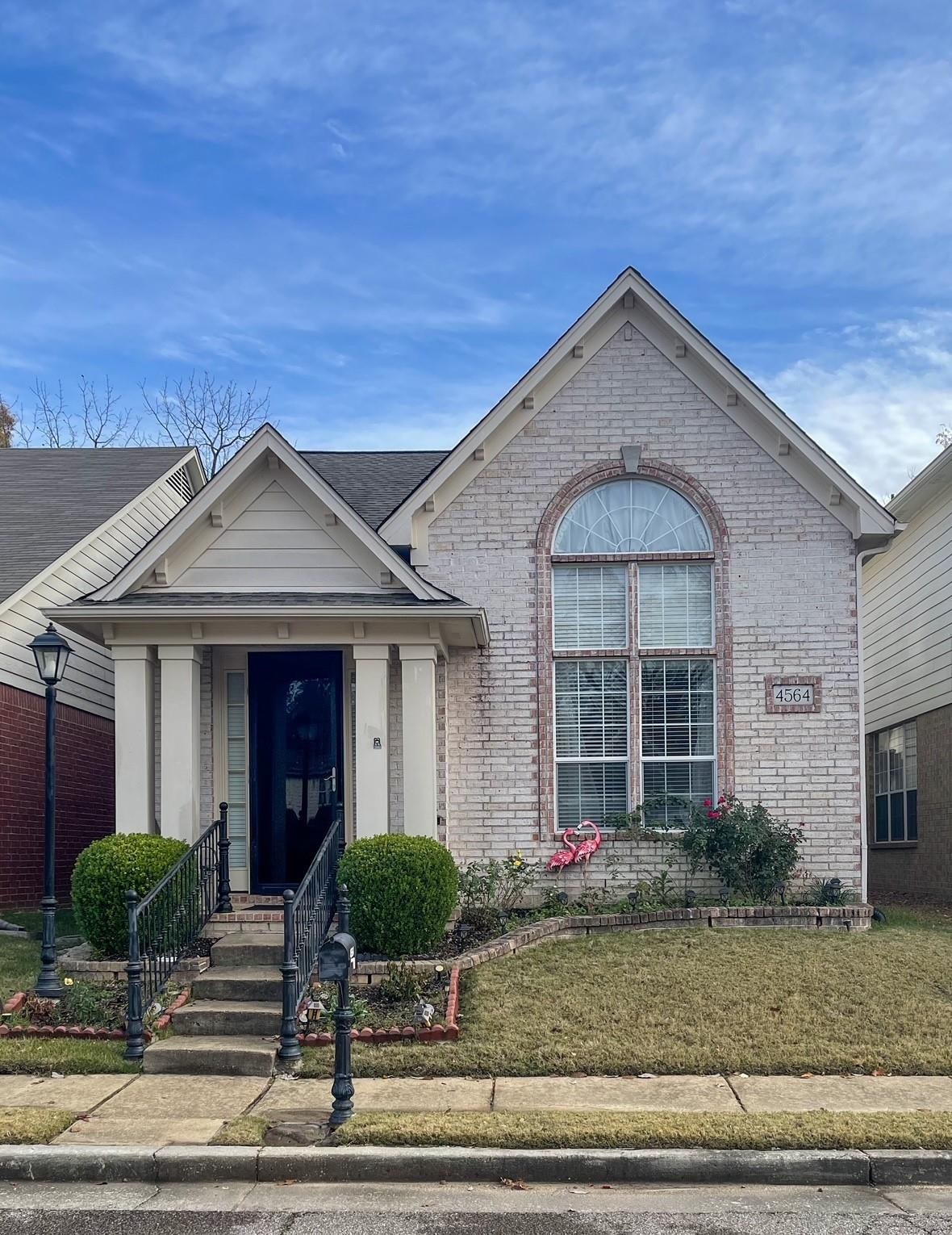 4564 Park Ridge Parkway Collierville, TN 38017 - Photo 1 of 12 a view of a brick house with yard and plants