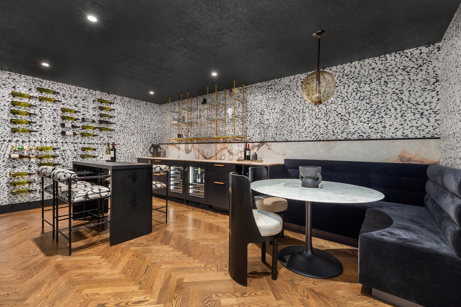 125 East 65th Street Manhattan, NY 10065 - Photo 19 of 26 a kitchen with a sink and chairs