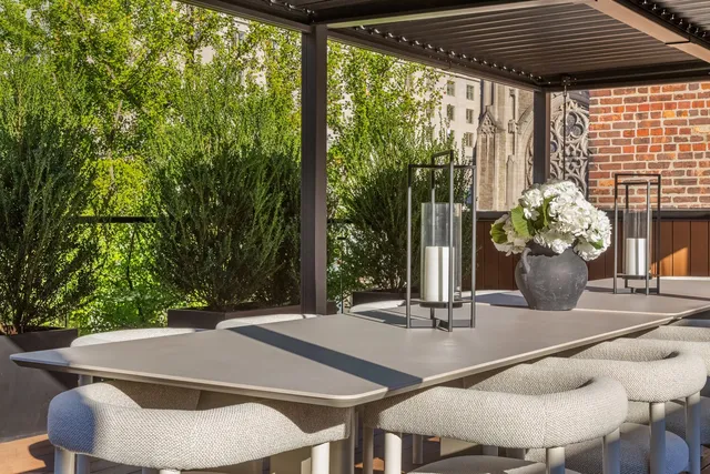 a patio with patio a couch and chairs