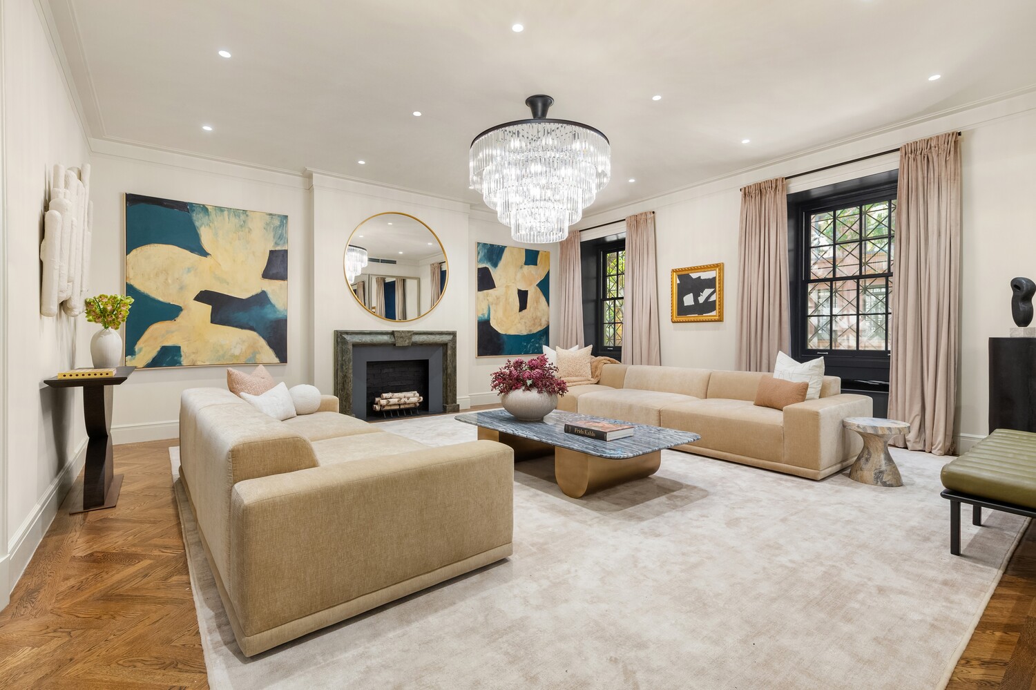 125 East 65th Street Manhattan, NY 10065 - Photo 8 of 26 a living room with fireplace furniture and a chandelier