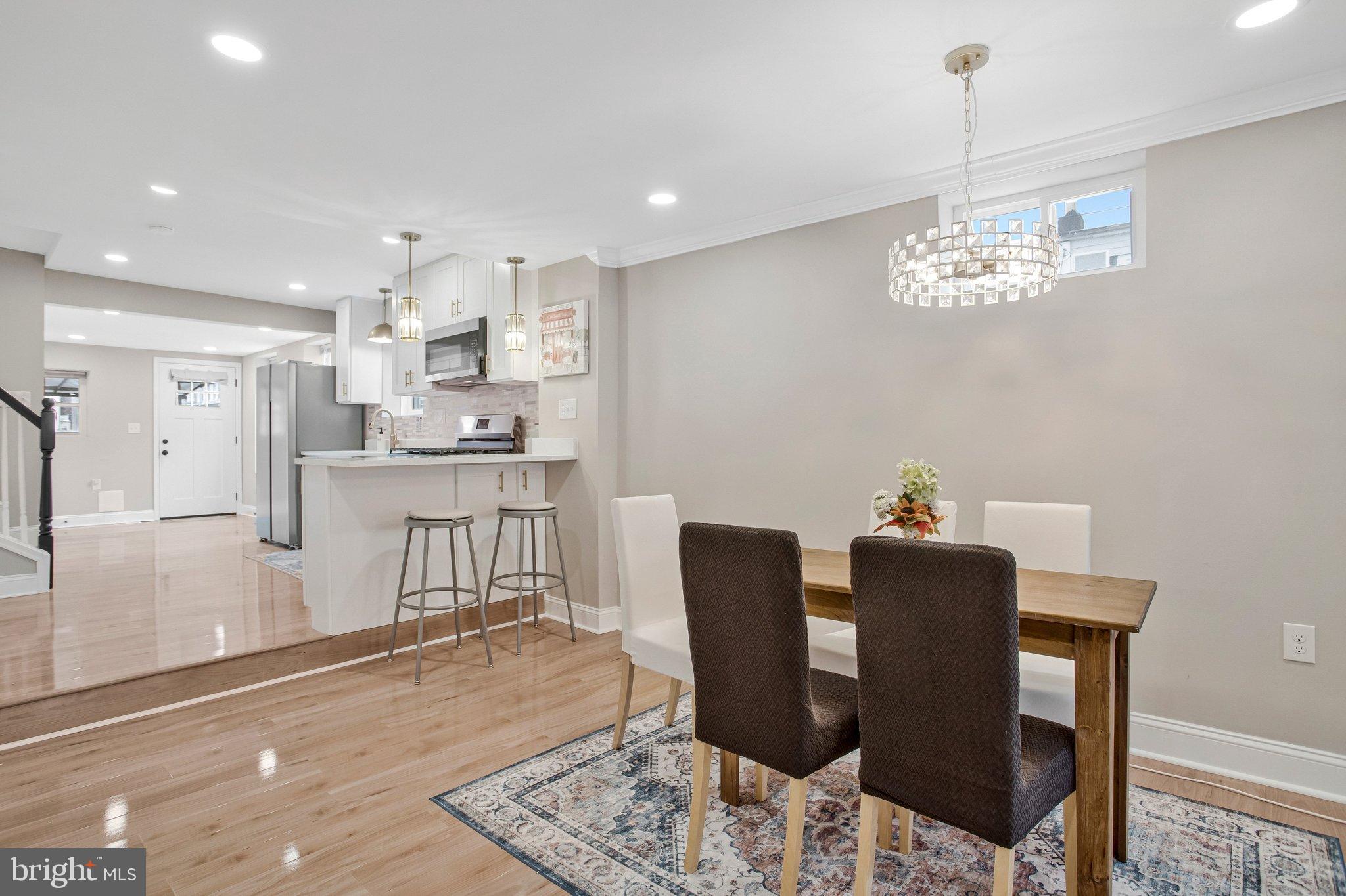 1102 Carroll Street Baltimore, MD 21230 - Photo 12 of 52 Modern dining area with elegant lighting.