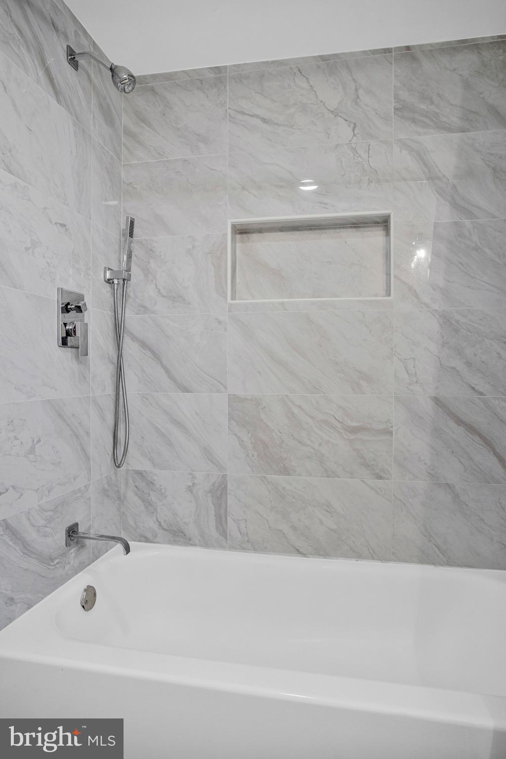 1102 Carroll Street Baltimore, MD 21230 - Photo 29 of 52 Sleek marble bath retreat for relaxation.