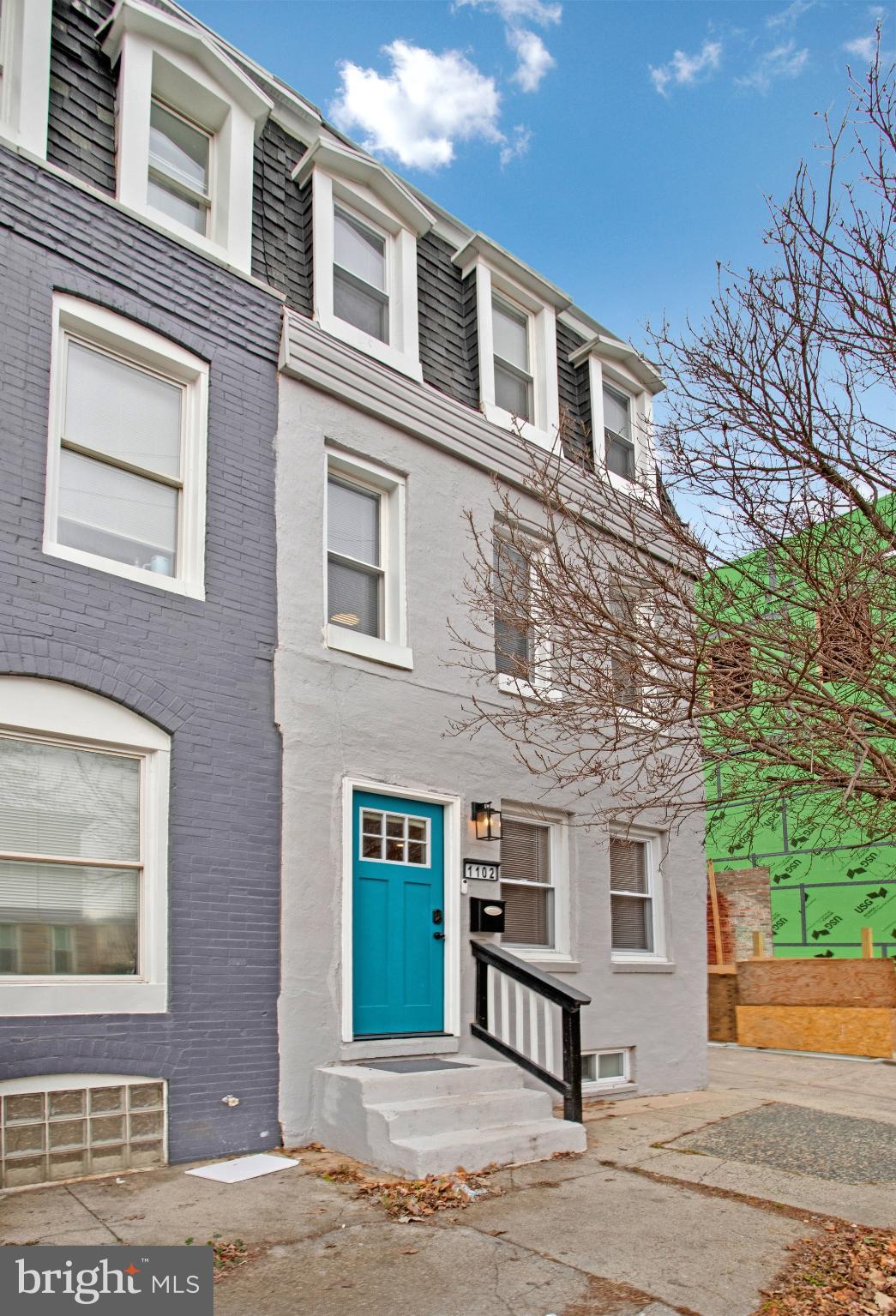 1102 Carroll Street Baltimore, MD 21230 - Photo 4 of 52 Charming townhouse with vibrant blue door.
