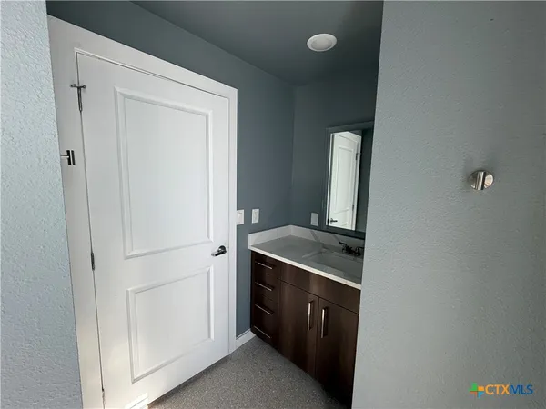 a kitchen with a stove and a refrigerator